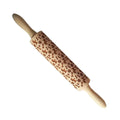 Solid wood rolling pin with embossed Christmas reindeer pattern on a 45cm long shaft.