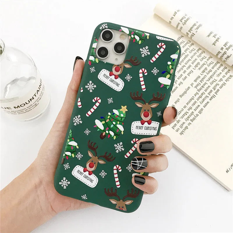 Green Christmas elk phone case with cartoon design showing elk and Christmas tree pattern