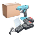 Cordless hot glue gun with two batteries, a charger, and a pack of glue sticks on a workbench.