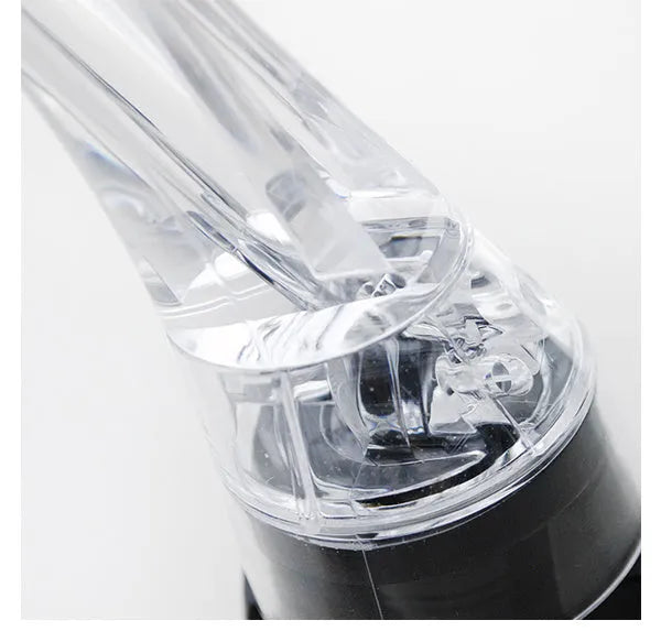 Wine aerator with stainless steel filter, measuring 16cm in length and 4.2cm in diameter, on a glass with red wine.
