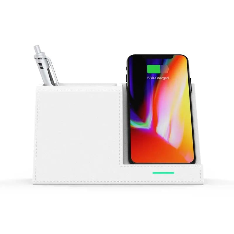 Black leather pen holder wireless charger on desk with phone charging and pens stored