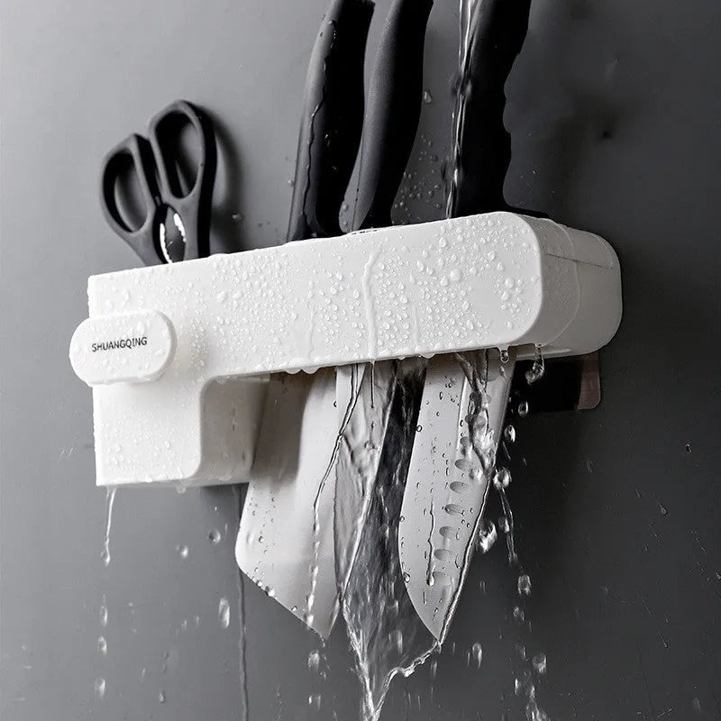 Modern white plastic kitchen knife rack with non-slip strip for wall or drawer mounting.