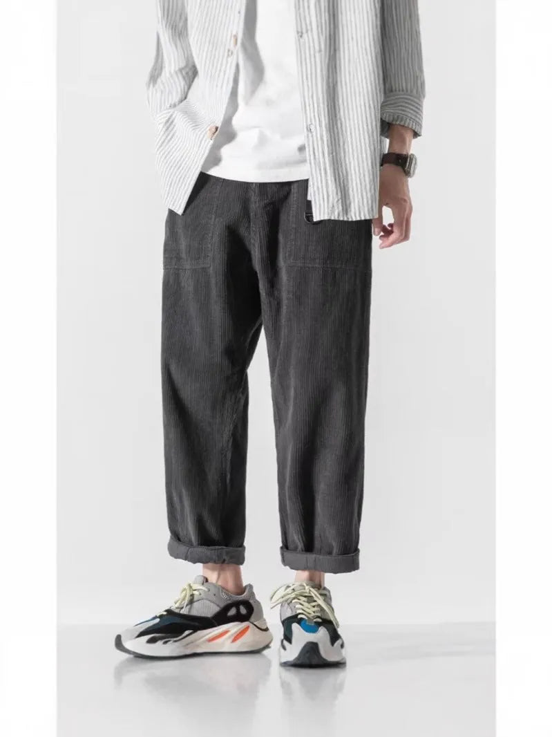 Loose straight tapered pants in dark grey, black, or khaki with wide legs and straight-leg opening