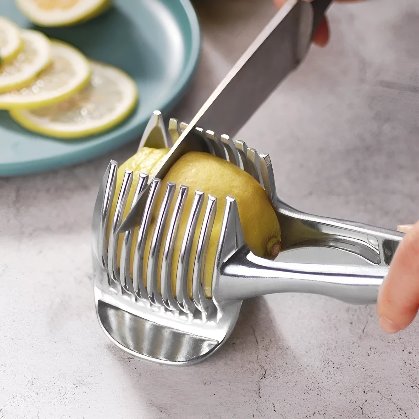 Silver plastic lemon slicer kitchen gadget showing folder design