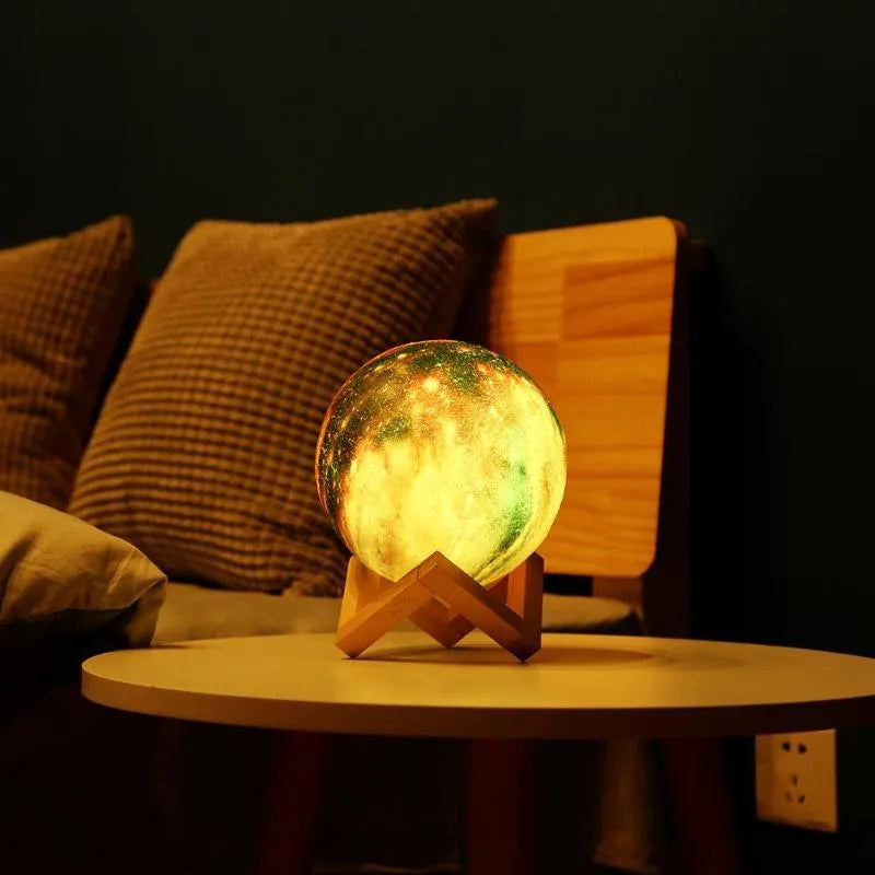 3D-printed lunar night light with LED colours, remote control, and touch sensor on wooden table