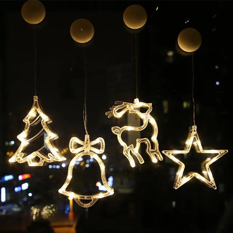 Battery-powered Christmas LED light set with Santa Claus, elk, and snowman designs stuck to a window with suction cups.