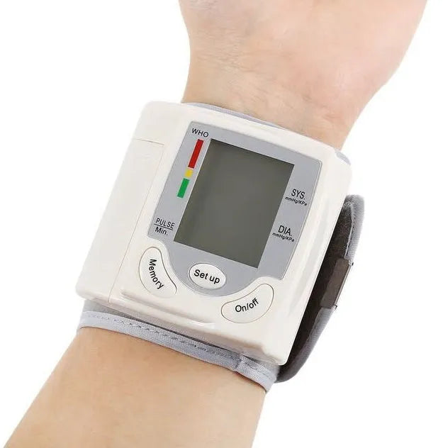 Grey portable wrist blood pressure monitor with digital display showing 70mm dimensions