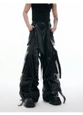 Black loose-fit quilted trousers with PU leather ribbon stitching and multiple pockets