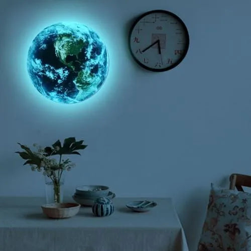 Glow in the dark 3D Earth wall sticker with self-adhesive backing, showing luminous effect in darkness
