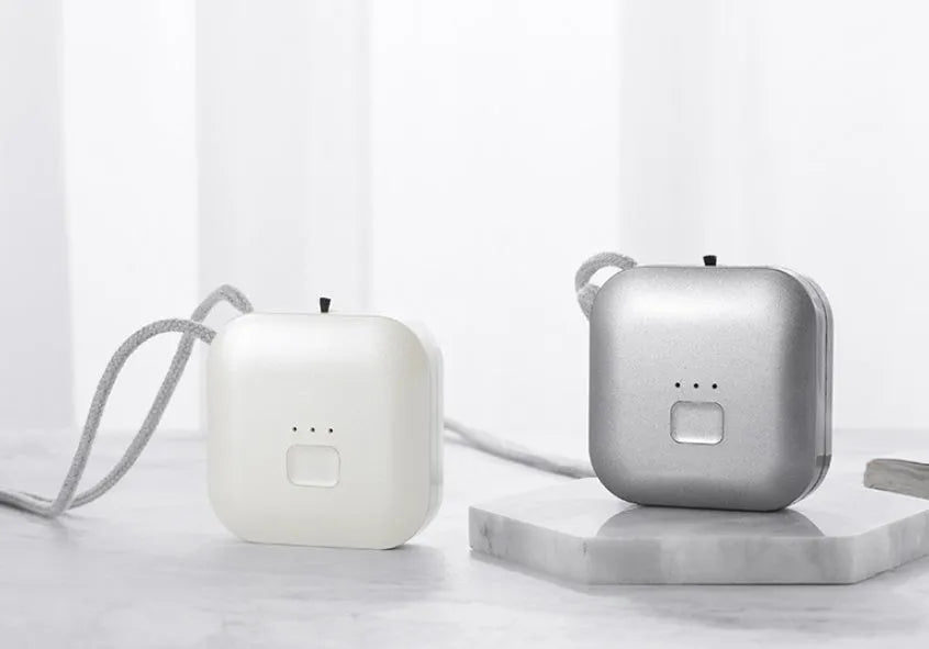 USB mini portable air purifier necklace in blue, showing compact design with USB charging port