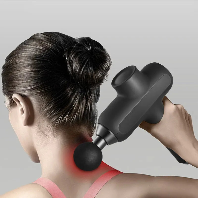 Rechargeable black percussion massage gun with six different coloured massage heads on a grey background.