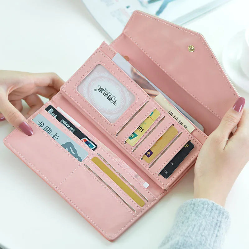 Three-fold student wallet in PU leather with buckle closure and clip, measuring 19.5cm length, available in five colours.