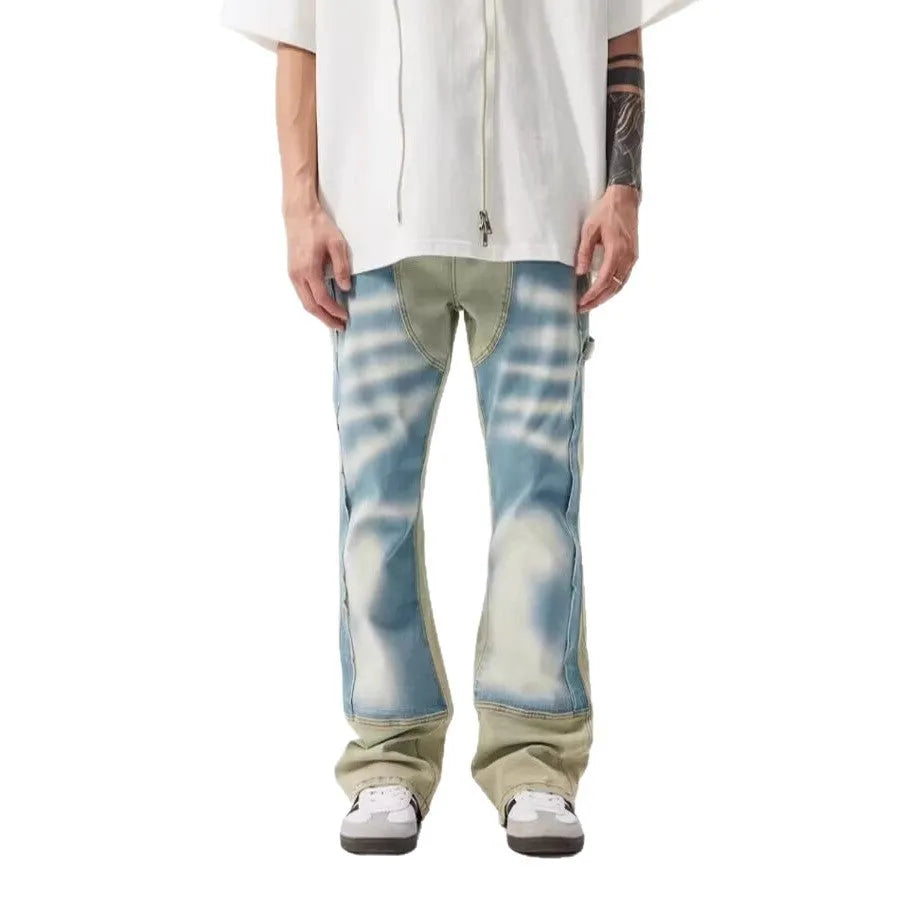 Retro dual-colour patchwork jeans with yellow and blue sections, splash-ink patterns, and distressed detailing on mid-waist denim trousers