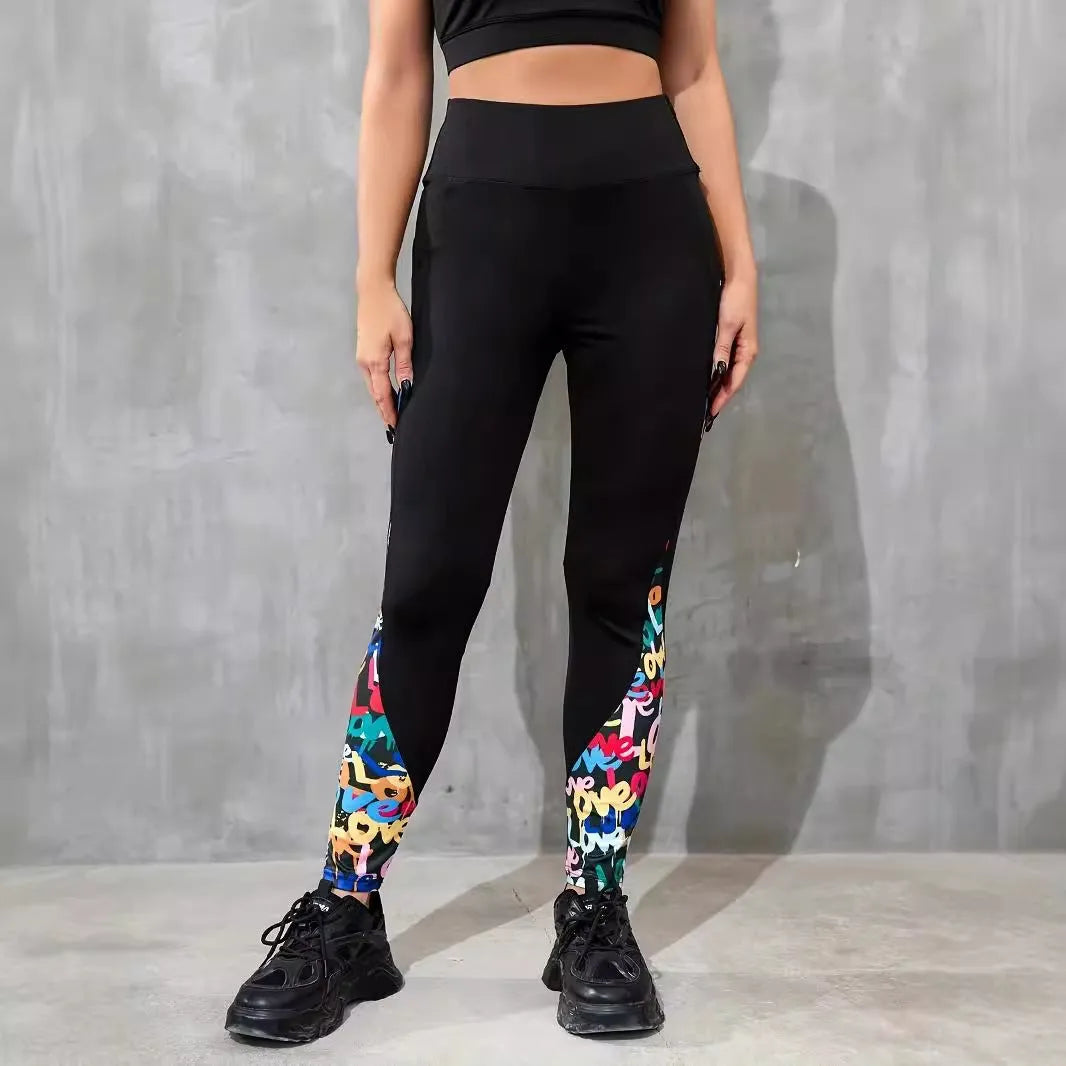Women's black polyester yoga leggings with side pocket and leopard print pattern detail