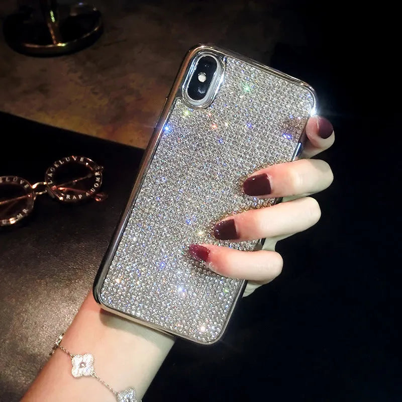 Silver silicone full diamond phone case for iPhone on a table