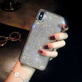 Silver silicone full diamond phone case for iPhone on a table