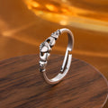 Retro silver coloured open band heart ring made of copper for women.