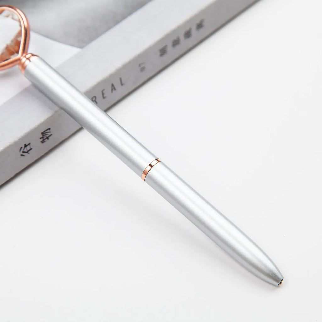 Golden Love Ball Crystal Diamond Metal Pen on a white background.