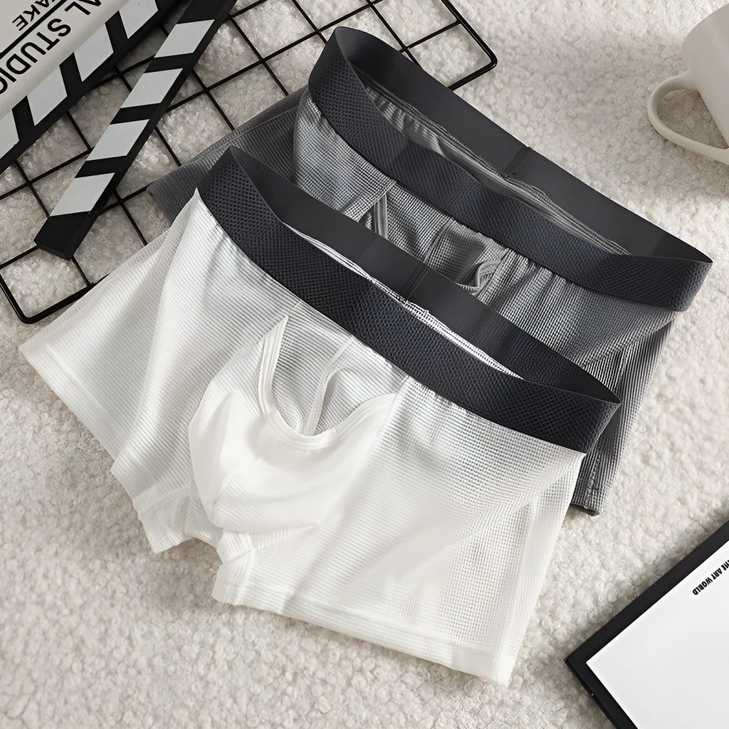 Men's ice silk boxer underwear in breathable mesh fabric showing low waist design
