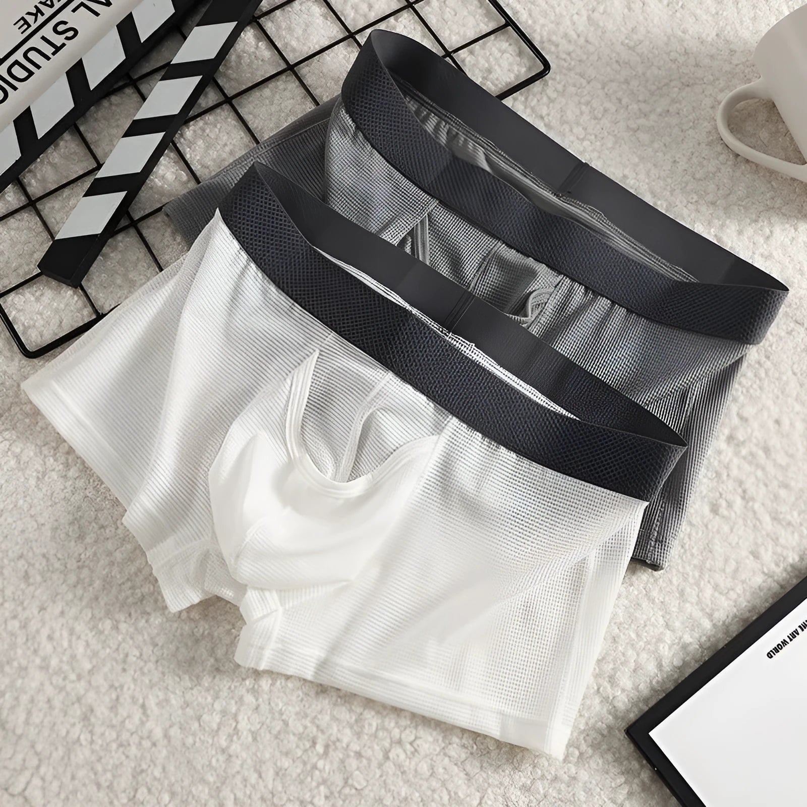 Men's ice silk boxer underwear in breathable mesh fabric showing low waist design