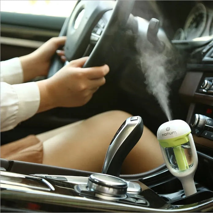 Compact car humidifier with 180-degree rotation nozzle in blue colour, showing ≤380ml/h capacity and 5W power specifications