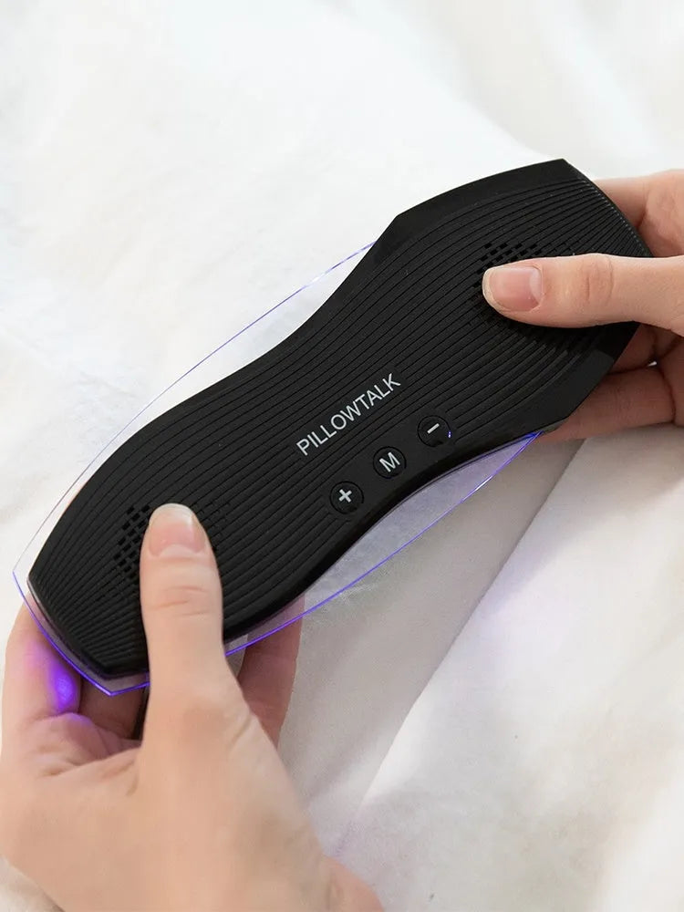 Black wireless in-ear headphones with USB charging port, designed for comfortable sleeping.