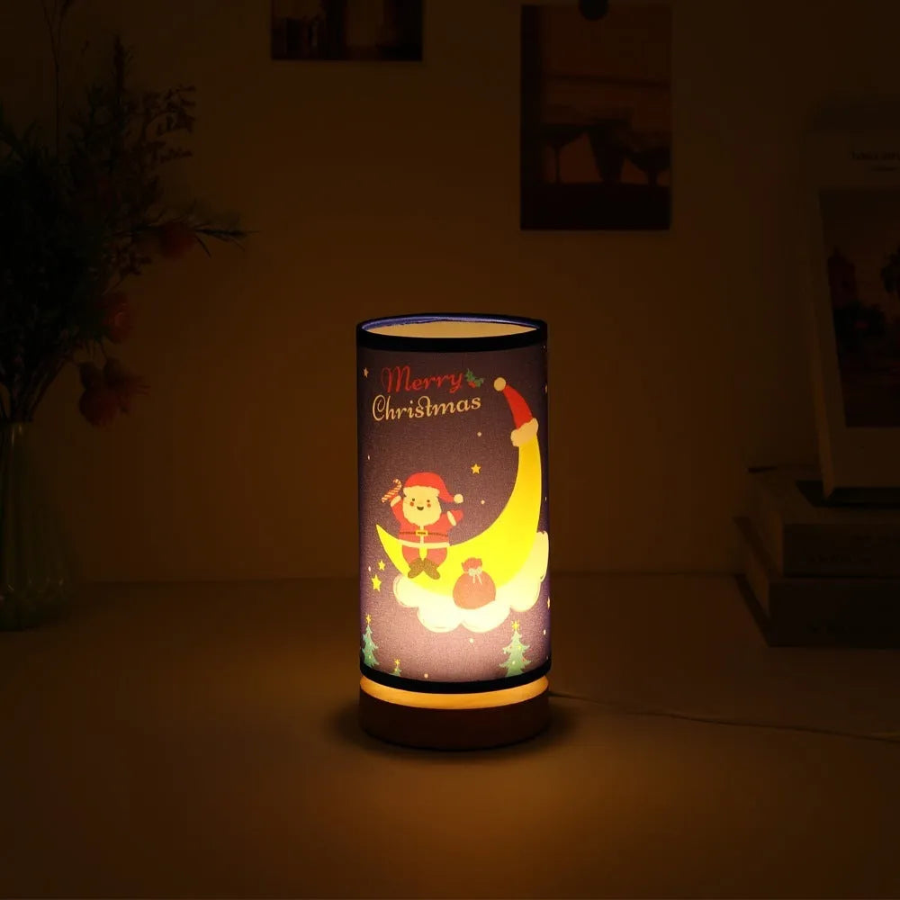 Moon-shaped Santa Claus LED night light with USB plug and bamboo base.