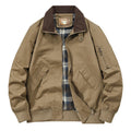 Men's beige washed cotton baseball-style flight jacket shown on a hanger.