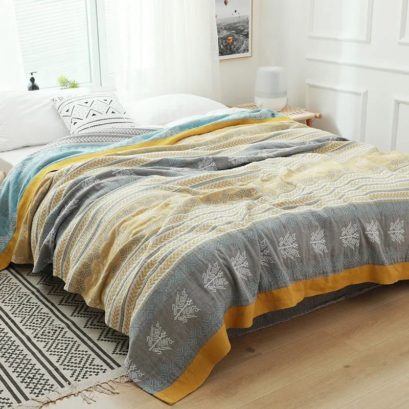 Five-layer gauze bed sheet blanket in Roulette Wheel Blue pattern on a bed