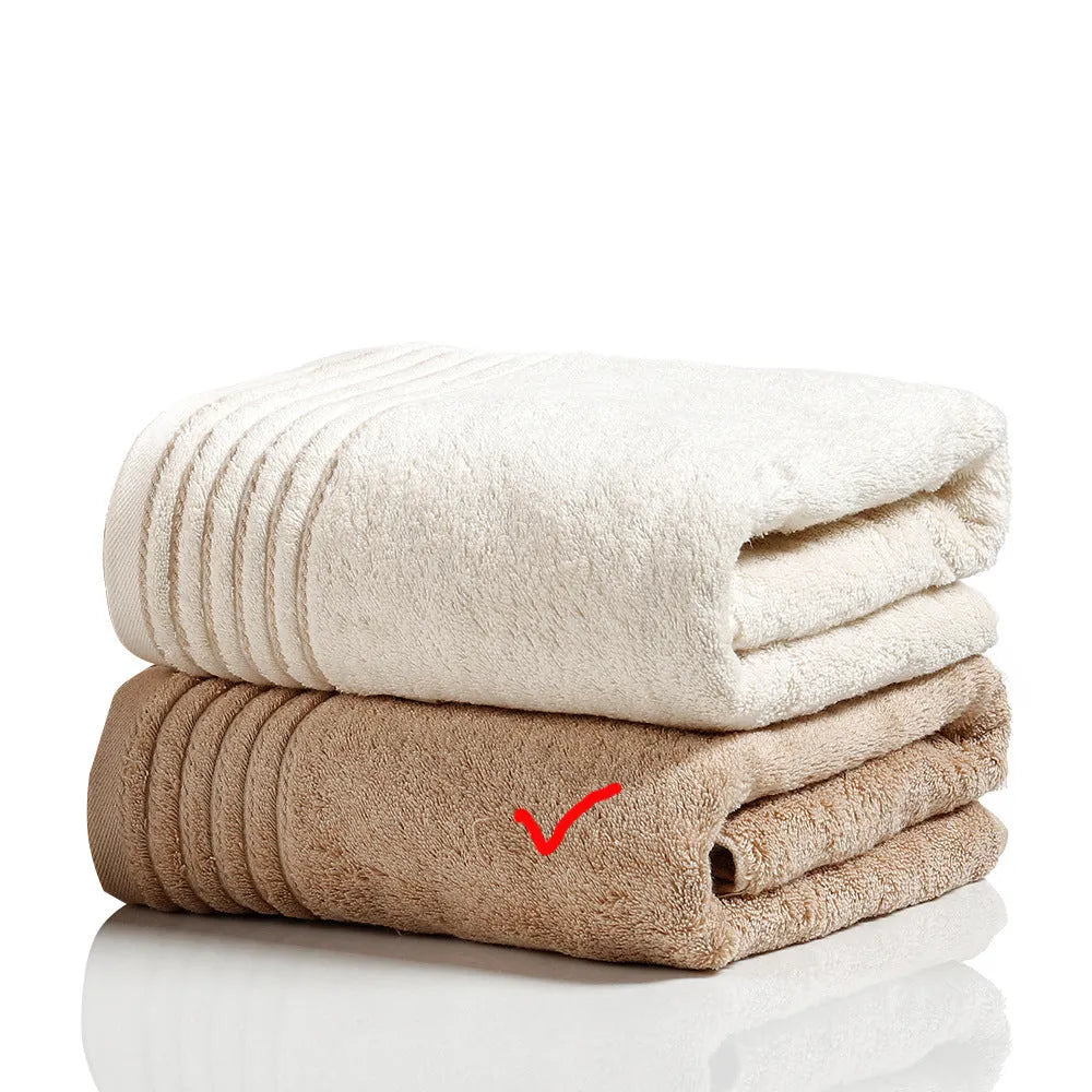 Cotton towel set in brown showing three sizes: large bath sheet, standard bath towel and small hand towel