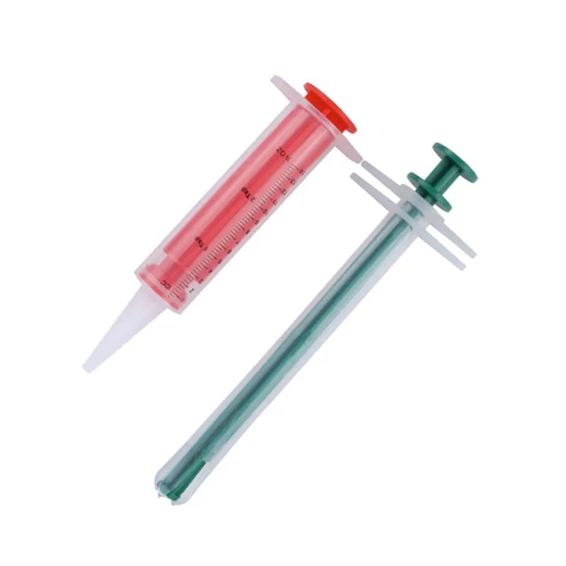 Two silicone pet pill shooters showing 15cm length and soft-tip design for medication administration