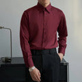 Man wearing a black loose-fit long sleeve cardigan shirt in Korean slim style with Japanese retro details.