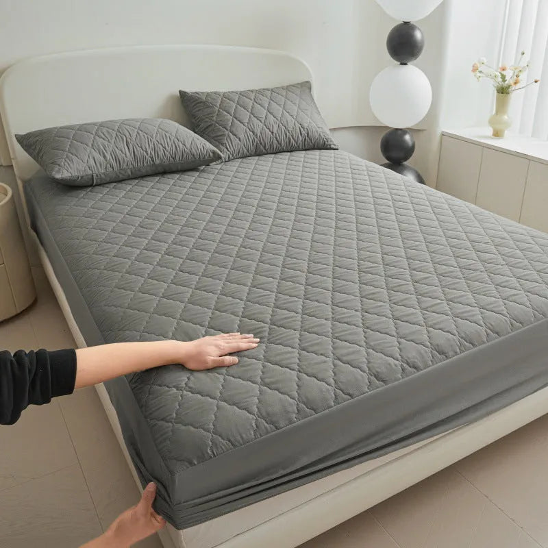 Diamond lattice quilted waterproof mattress protector set in black, grey, pink, or white with bamboo fibre material and fitted sheet sizes.