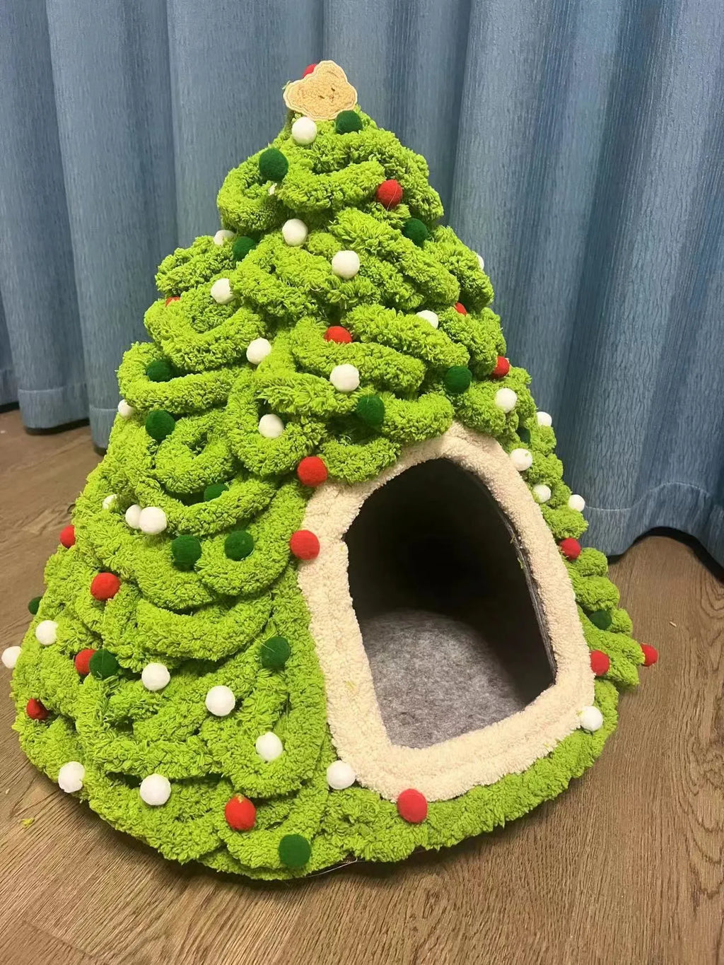 Grey conical felt cat house for indoor cats under 12 pounds.