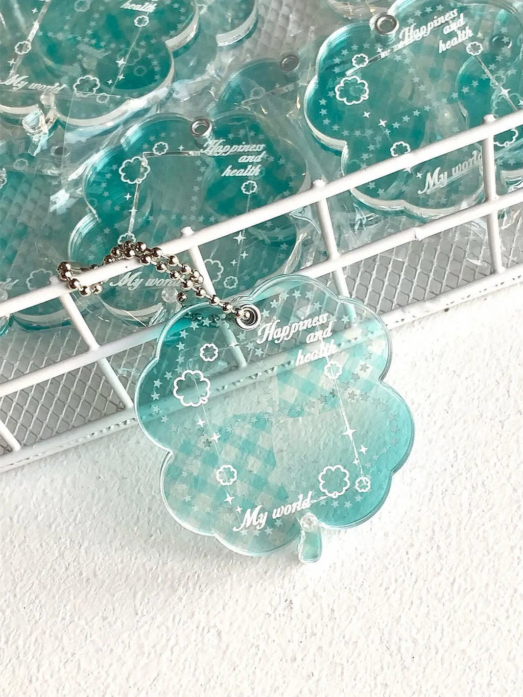 Blue, green, and mint green four-leaf clover acrylic phone pendant keychain.