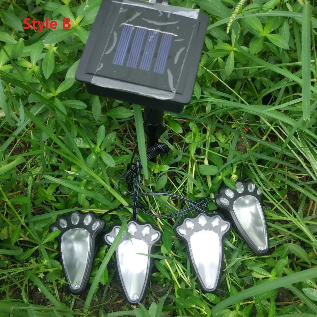 Black bear paw-shaped solar garden lights with solar panel, measuring 9cm, for outdoor pathway decoration