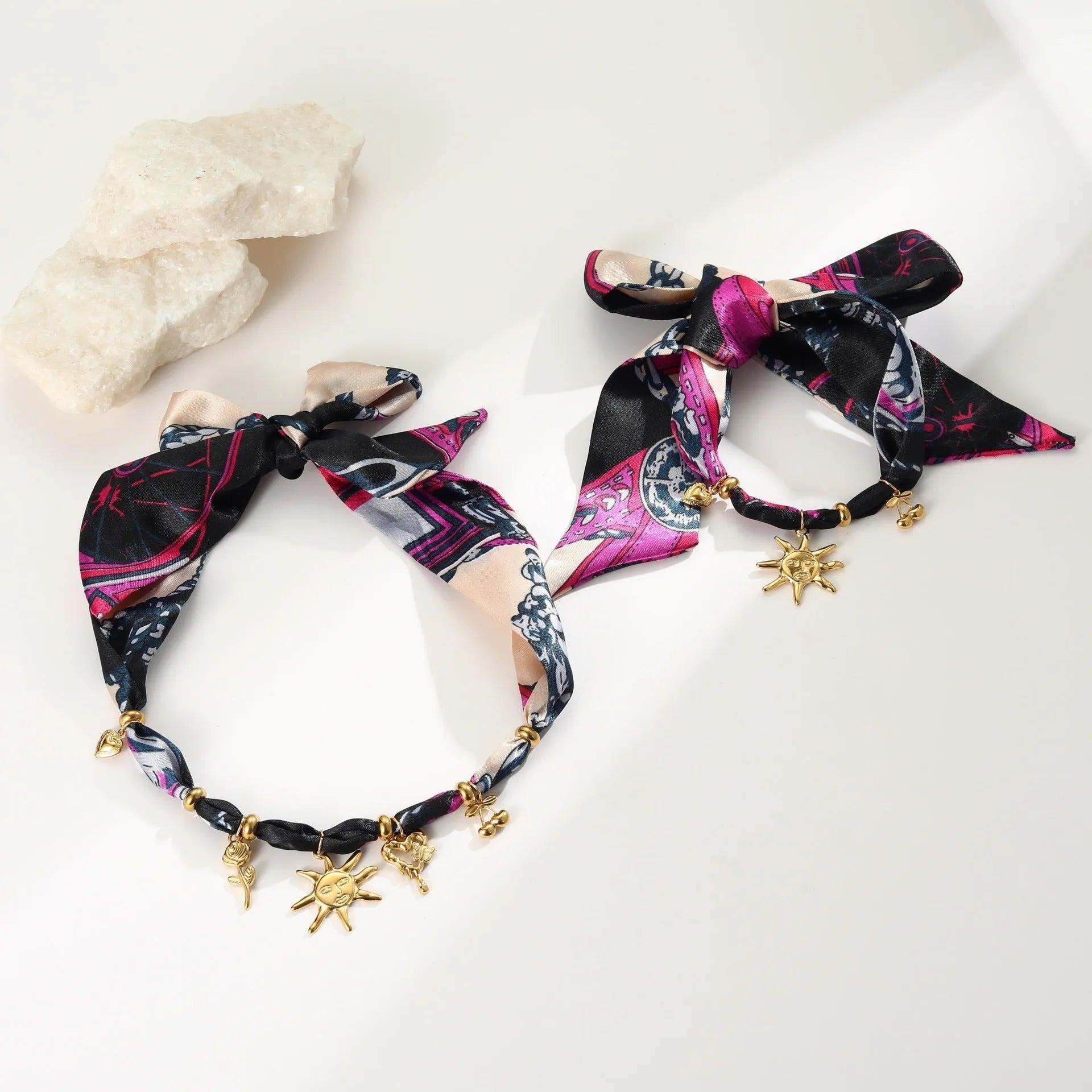 Stainless steel geometric pendant necklace and bracelet set with 18K gold-colour electroplated finish.