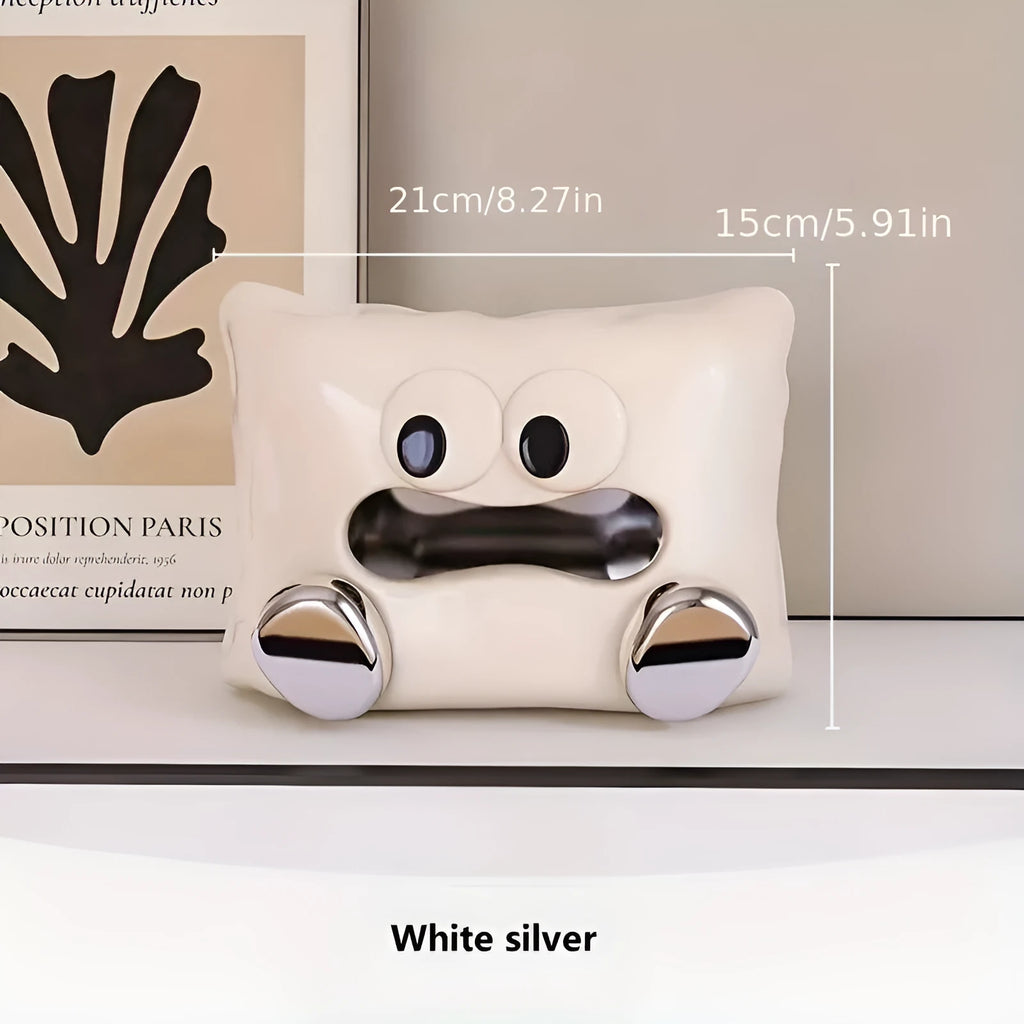 White ceramic tissue box holder with lid on a wooden coffee table.