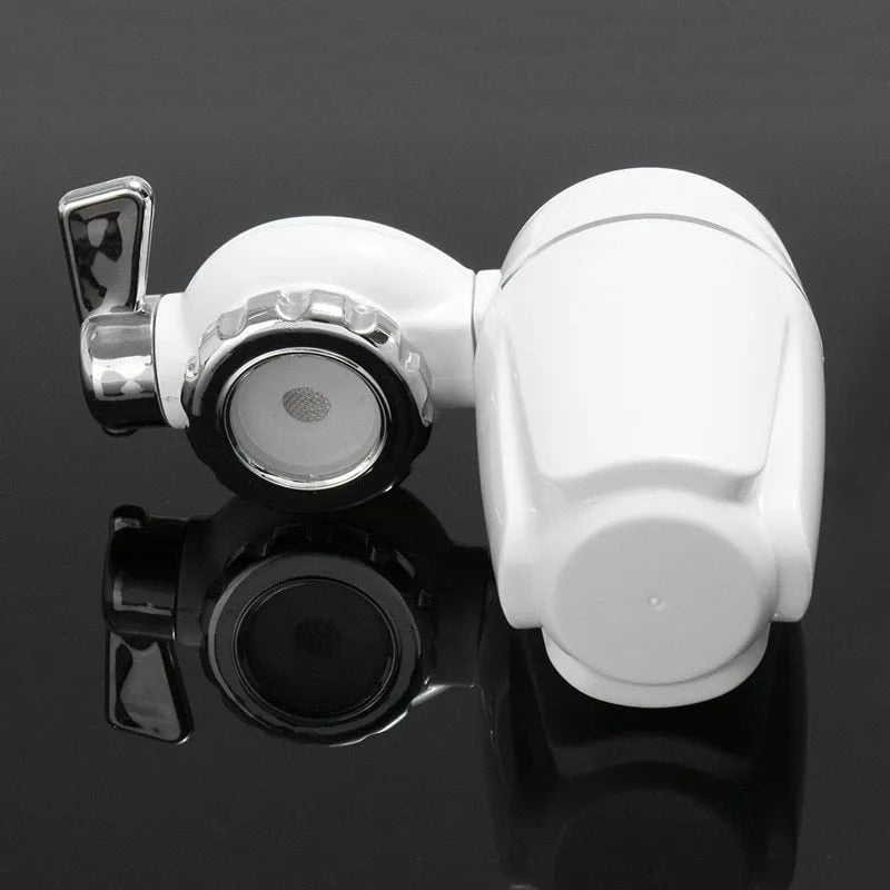 White plastic faucet water filter with universal adapter kit and ceramic cartridge on a kitchen tap.