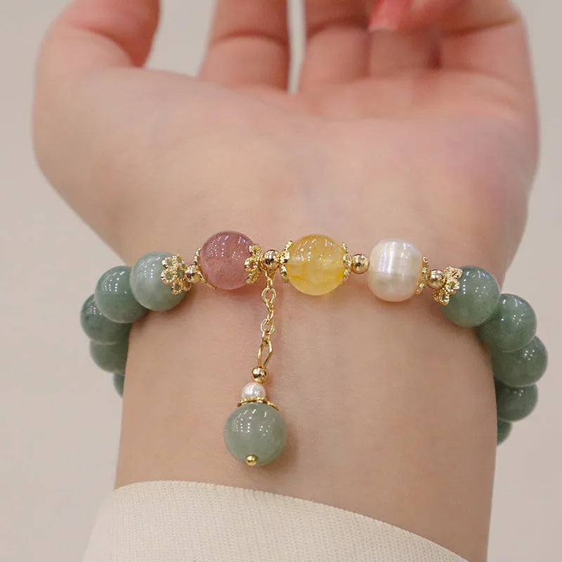Green Myanmar jade beaded bracelet with pearls and 3D decoration in a geometric Han style design.