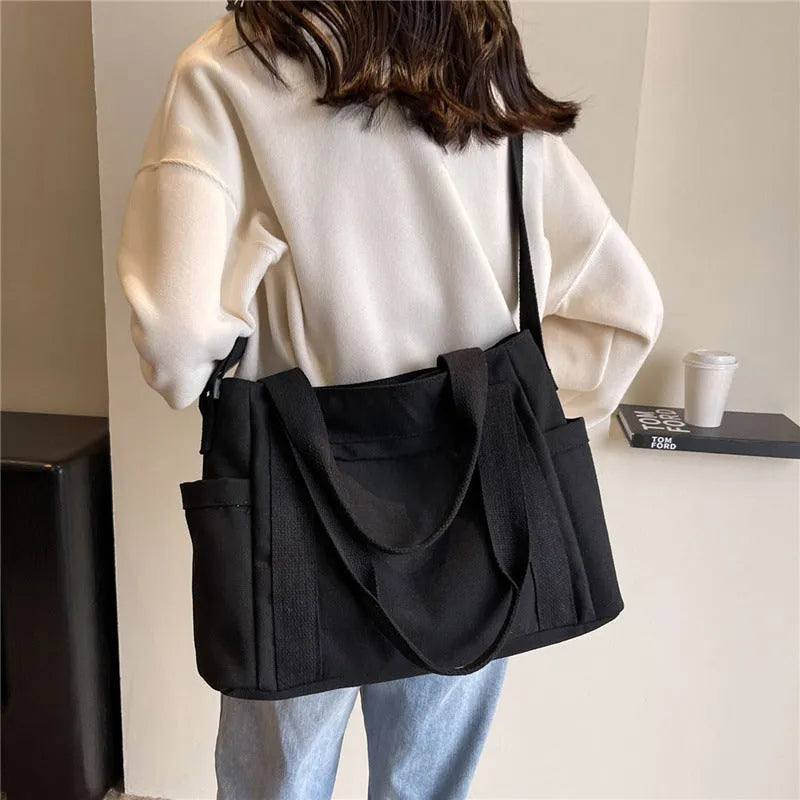 Women's shoulder tote bag in solid colour with sandwich pocket and internal mobile phone compartment for leisure travel