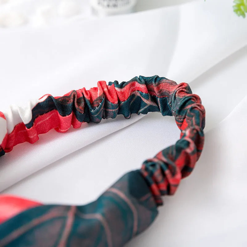Red cloth women's headband with banana leaf cross design for hair management