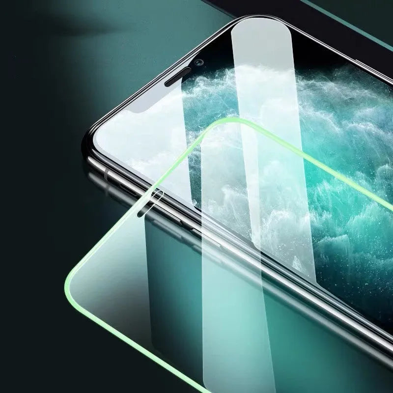 Luminous tempered glass screen protector glowing on iPhone in dark room with 9-layer protection diagram