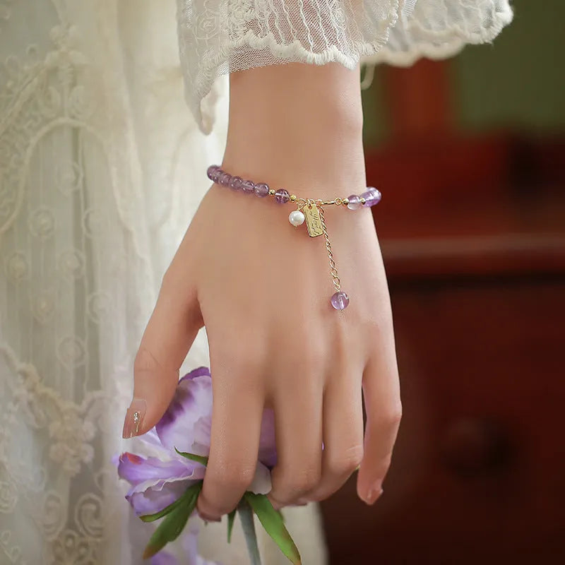Natural lavender amethyst crystal bracelet with zodiac motifs and adjustable clasp in light or dark colour options