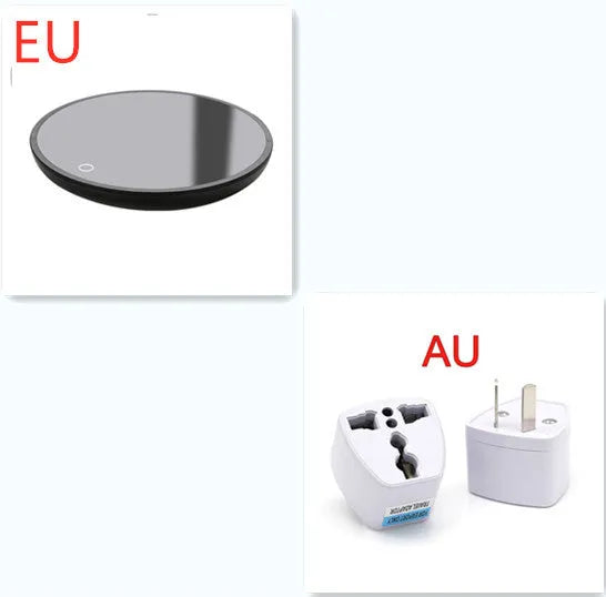 Black coffee cup warmer pad with temperature switch on a desk next to a mug.