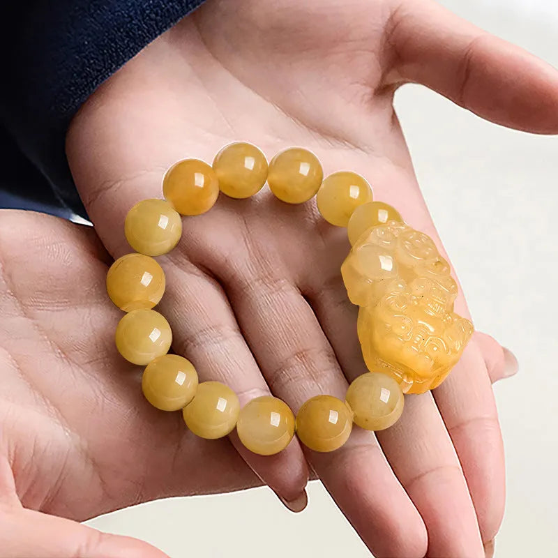 Hand-carved Jinsi Jade money bracelet with golden thread patterns, showing large and small size options for unisex wear