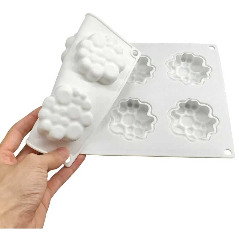 Round silicone cake mould with 8 bubble tower pattern design on a kitchen worktop.