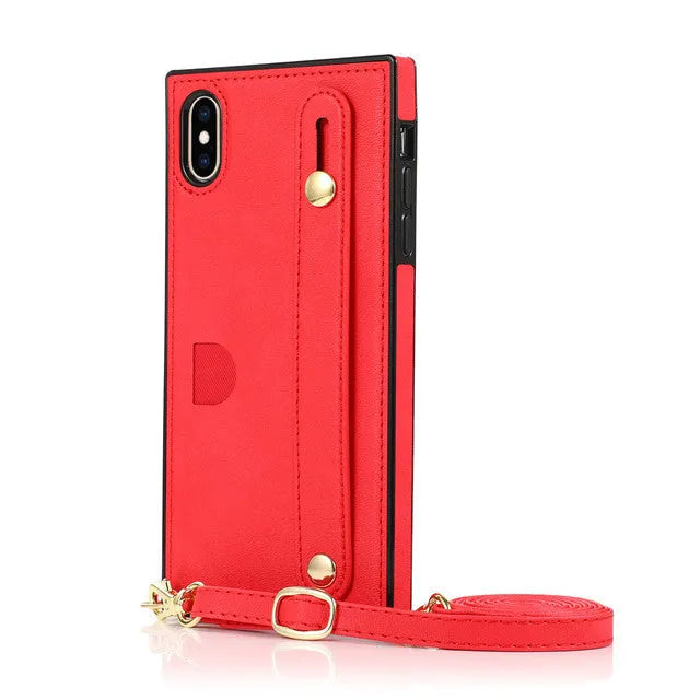 Leather phone case with card slot and wristband in black, showing iPhone 12 model inserted.