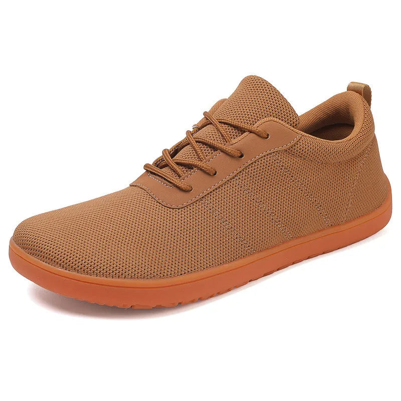 Men's black Flyknit walking shoes with wide round toe and flat wedge heel on a non-slip rubber sole.