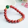 Emperor Sandstone coloured cinnabar bracelet with six engraved Chinese characters on 8mm beads.